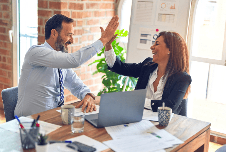 Two people agreeing on something in a meeting